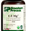 Image of E-Z Mg bottle next to tablets of magnesium supplements.